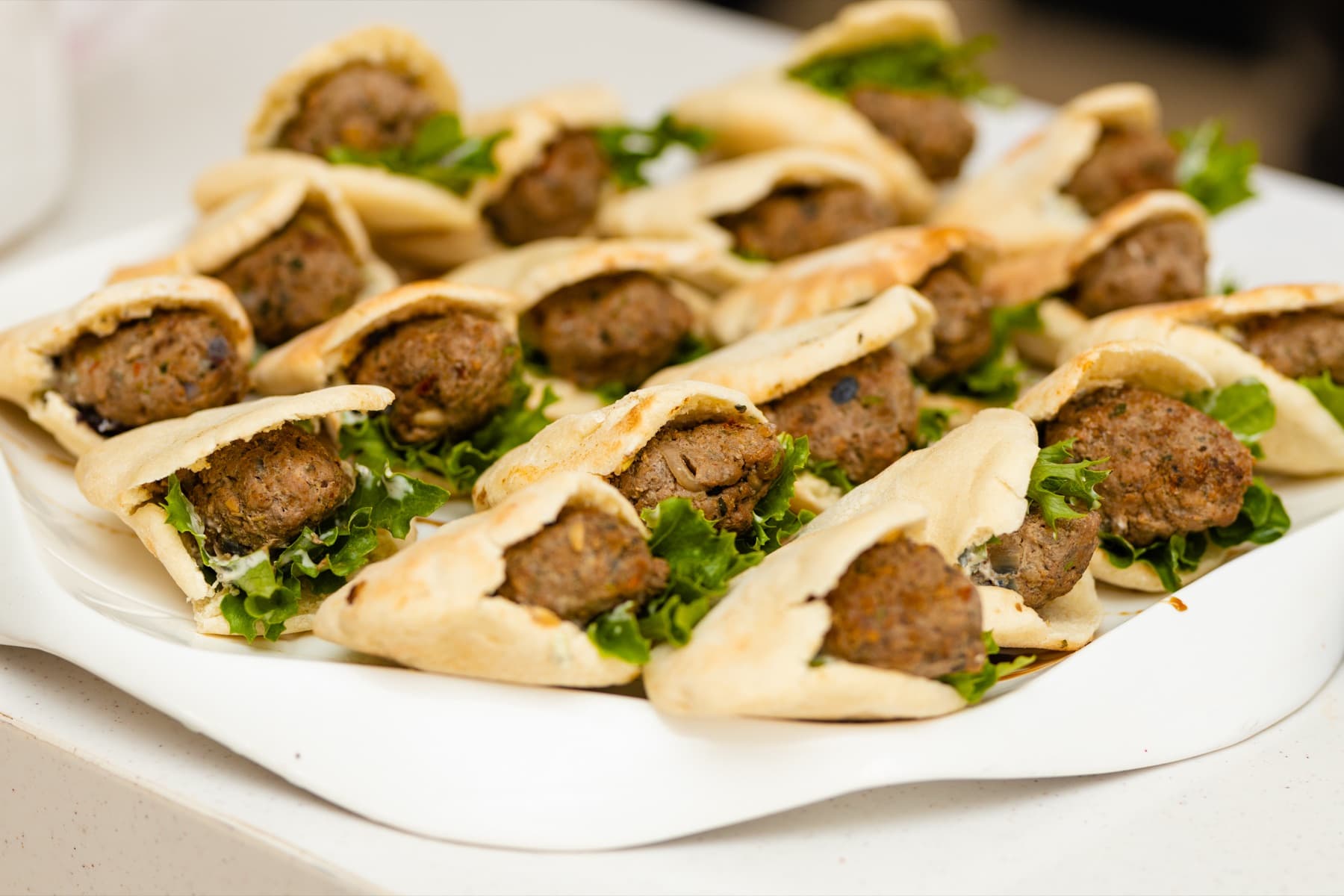 Freshly prepared sliders from a catered event