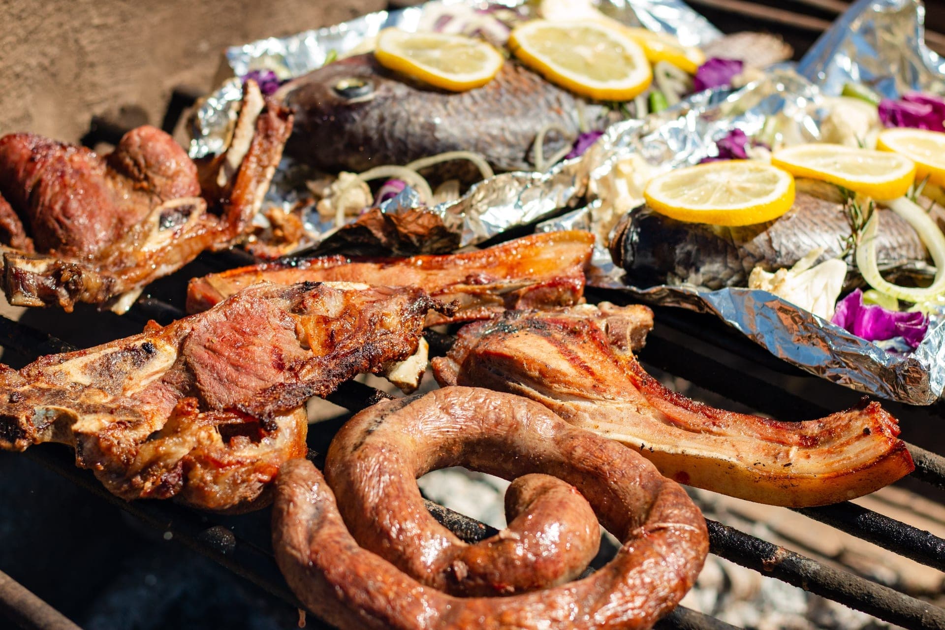 A chef's selection cooking over the grill for a private event