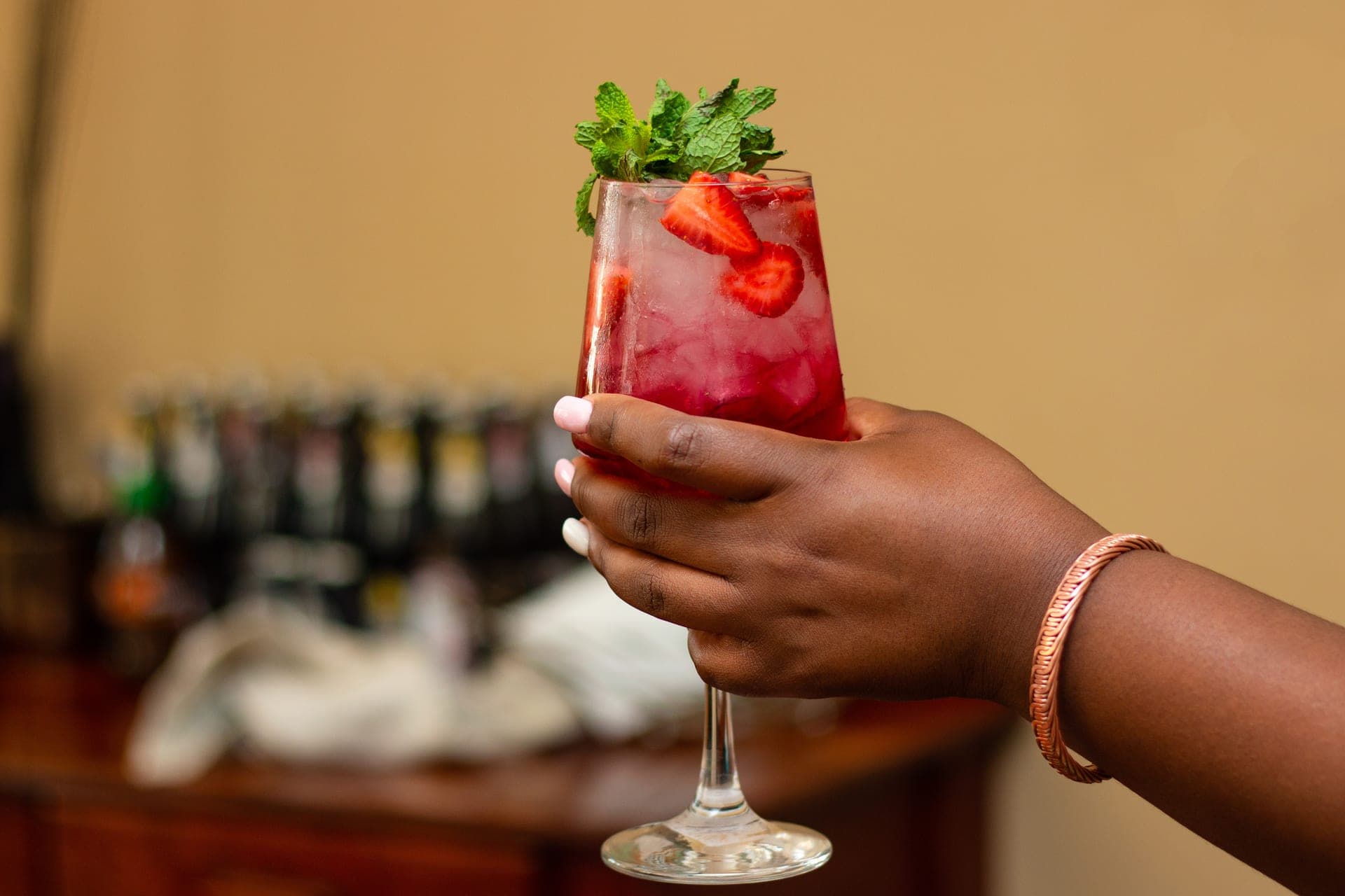 Behind the bar: a drink being built during service at an event